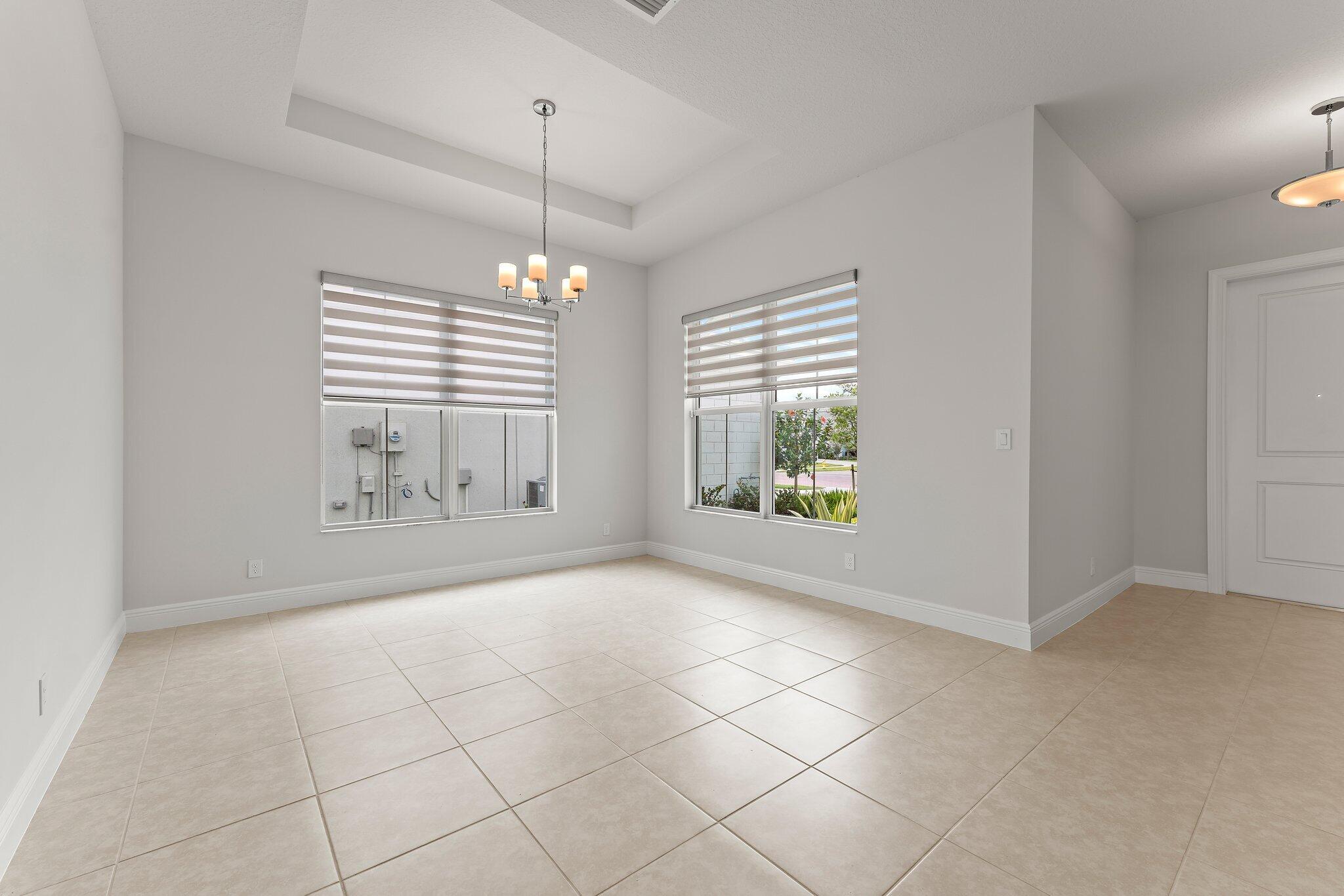 12622 Nautilus Circle Palm Beach Gardens, FL 33412 - Photo 7 of 66 a view of an empty room with a window