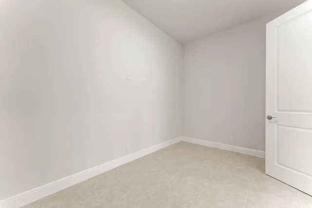 a view of an entryway door and hallway