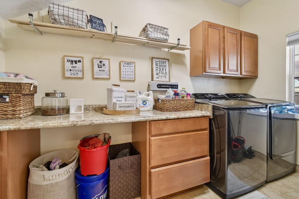 3302 Jap Tucker Road Plant City, FL 33566 - Photo 13 of 44 a kitchen with a sink and cabinets