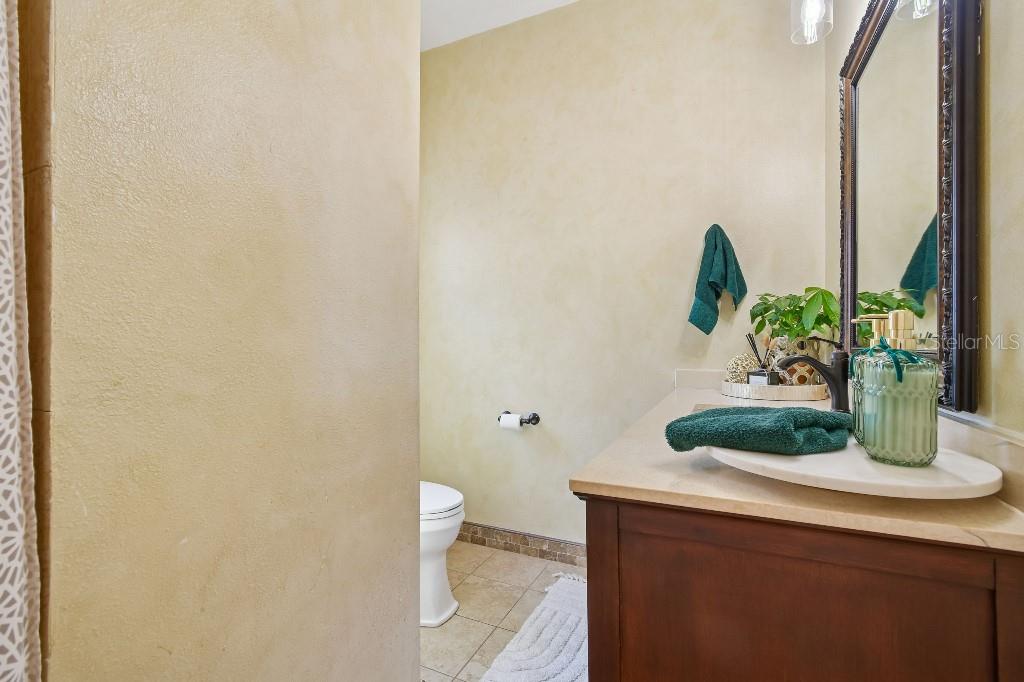 3302 Jap Tucker Road Plant City, FL 33566 - Photo 16 of 44 a bathroom with a sink and a mirror