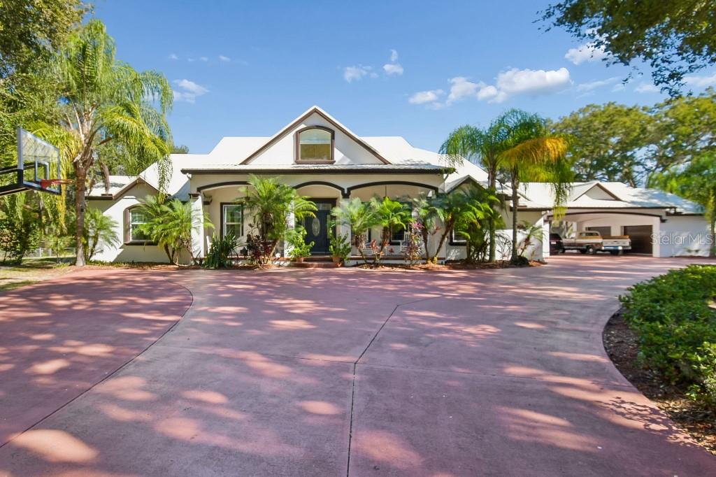 3302 Jap Tucker Road Plant City, FL 33566 - Photo 2 of 44 a front view of a house with a yard