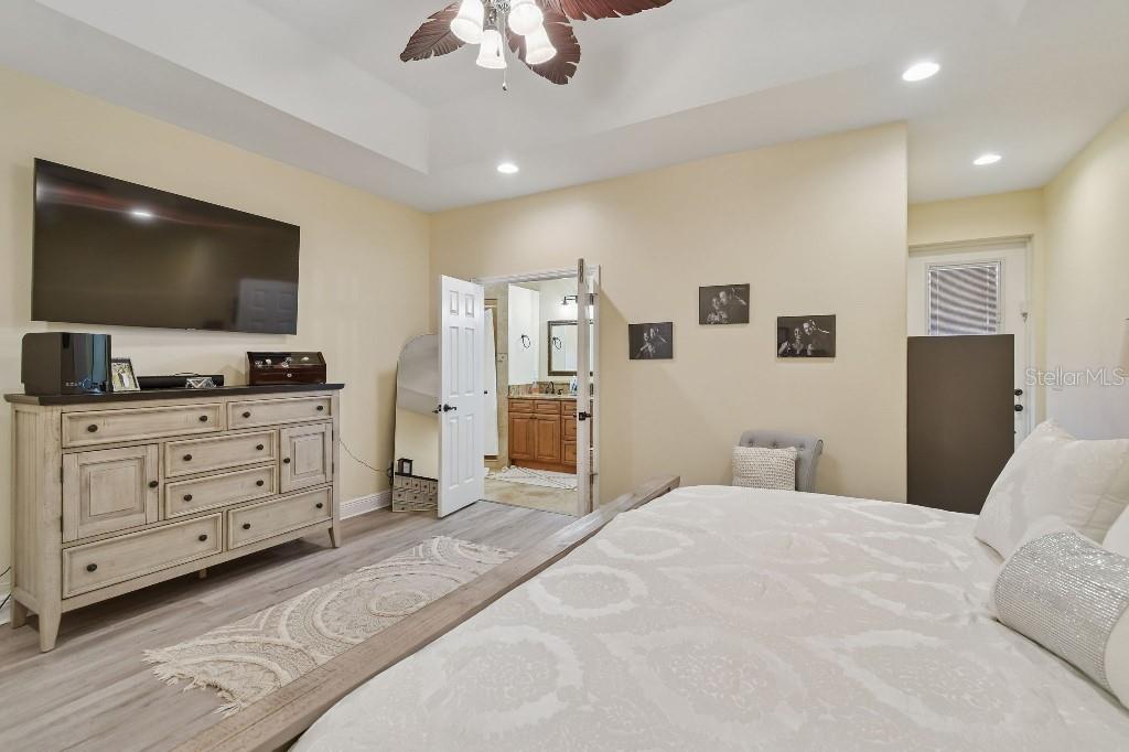 3302 Jap Tucker Road Plant City, FL 33566 - Photo 25 of 44 a bedroom with a bed and a flat screen tv