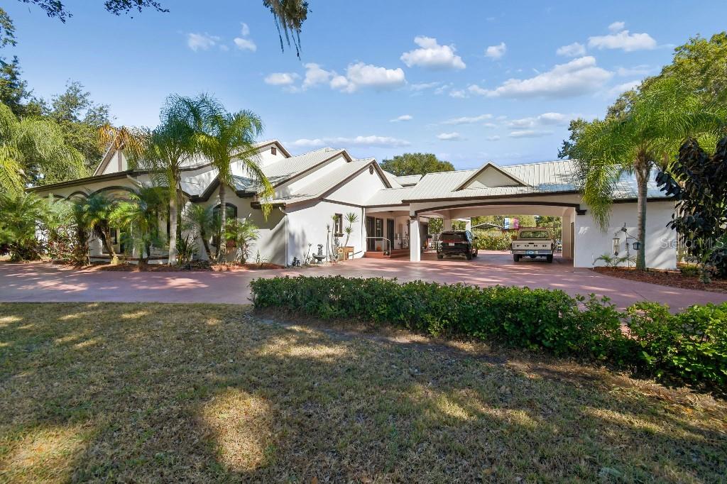 3302 Jap Tucker Road Plant City, FL 33566 - Photo 3 of 44 a front view of house with yard and green space