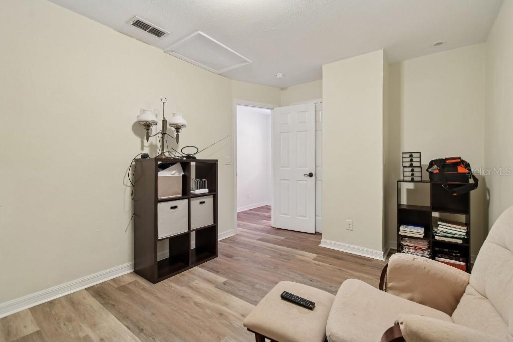 3302 Jap Tucker Road Plant City, FL 33566 - Photo 32 of 44 a living room with furniture and wooden floor