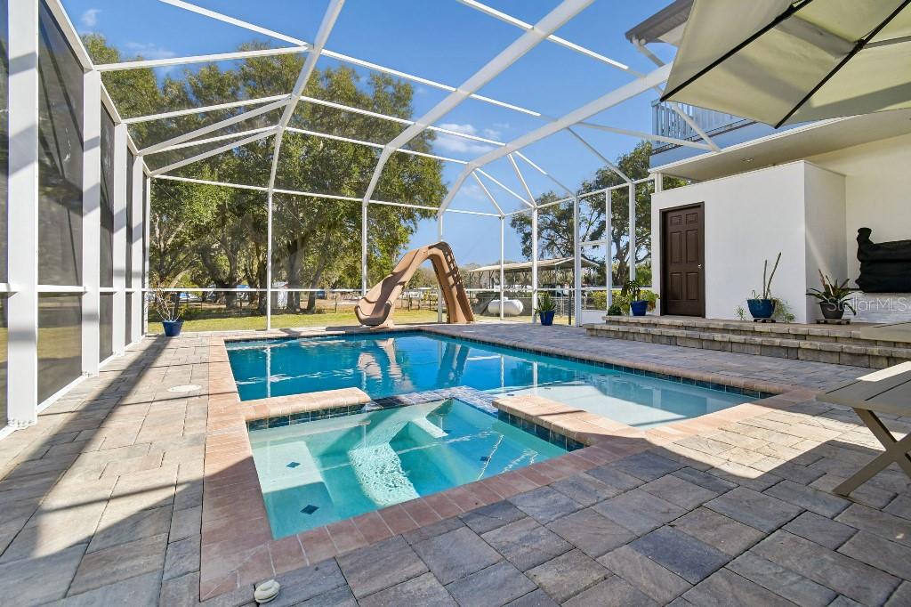 3302 Jap Tucker Road Plant City, FL 33566 - Photo 35 of 44 a view of a swimming pool with lounge chair