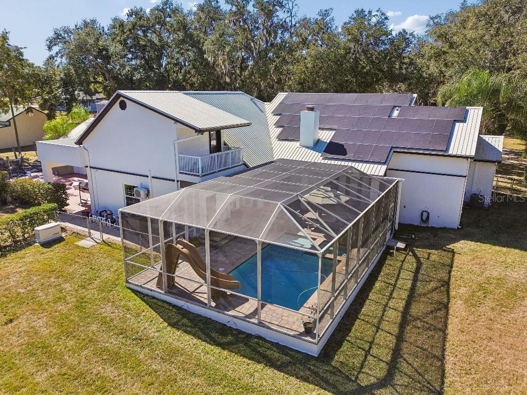 3302 Jap Tucker Road Plant City, FL 33566 - Photo 38 of 44 a aerial view of a house with swimming pool in front of it