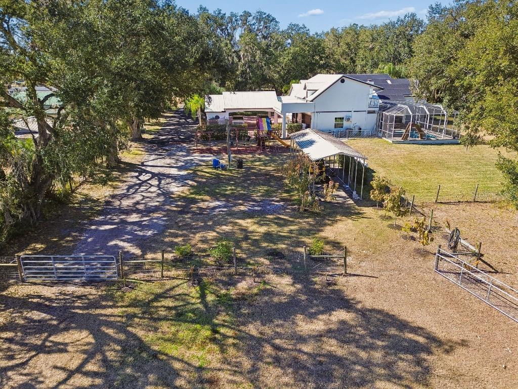 3302 Jap Tucker Road Plant City, FL 33566 - Photo 40 of 44 a view of a house with a yard and sitting area