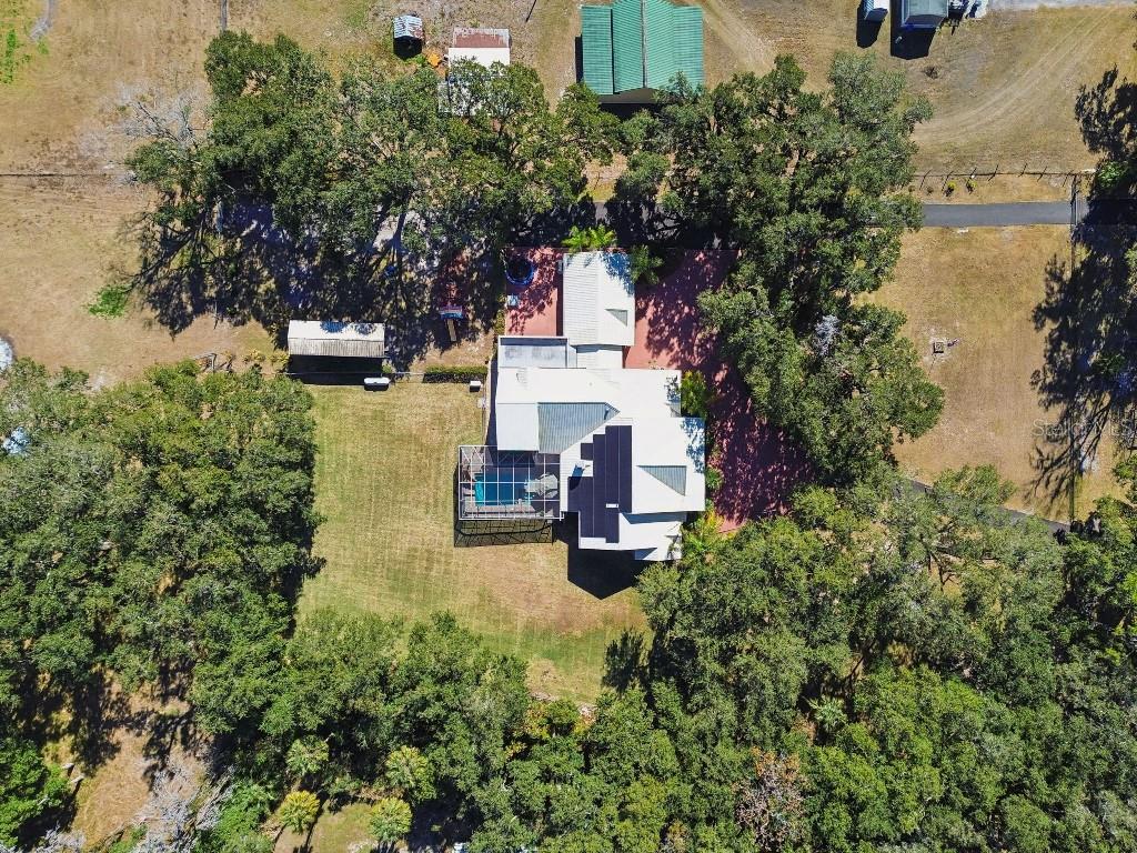 3302 Jap Tucker Road Plant City, FL 33566 - Photo 43 of 44 an aerial view of a house with swimming pool and garden