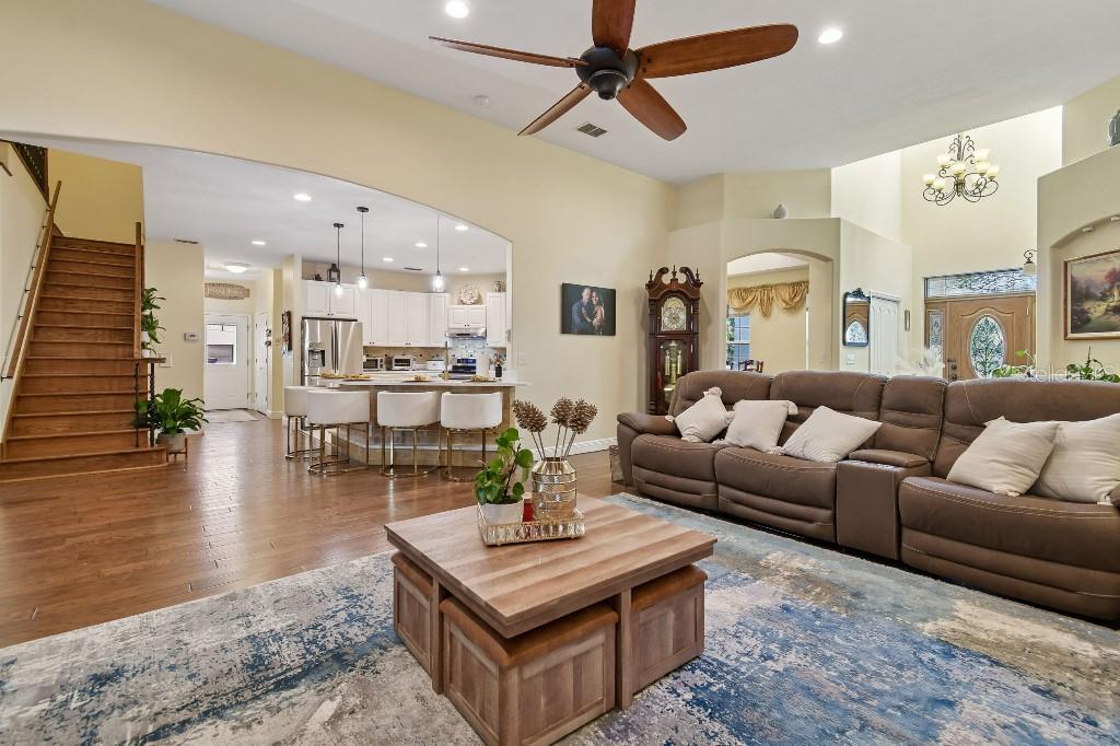 3302 Jap Tucker Road Plant City, FL 33566 - Photo 10 of 44 a living room with furniture and a view of kitchen