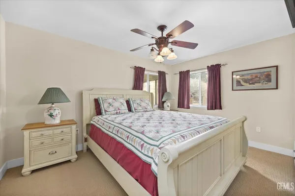 a living room with furniture a dining table and a piano table