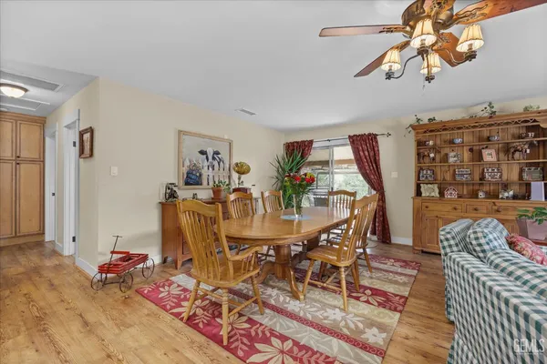 a kitchen with a sink stove top oven and cabinets
