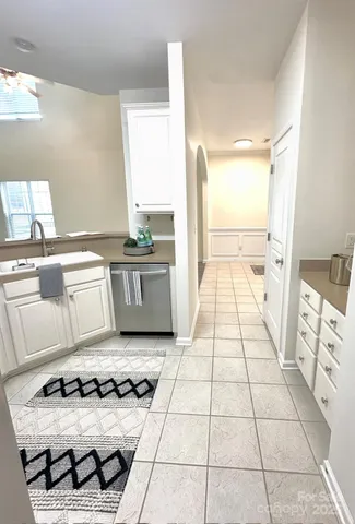 a kitchen with a stove a sink and a refrigerator