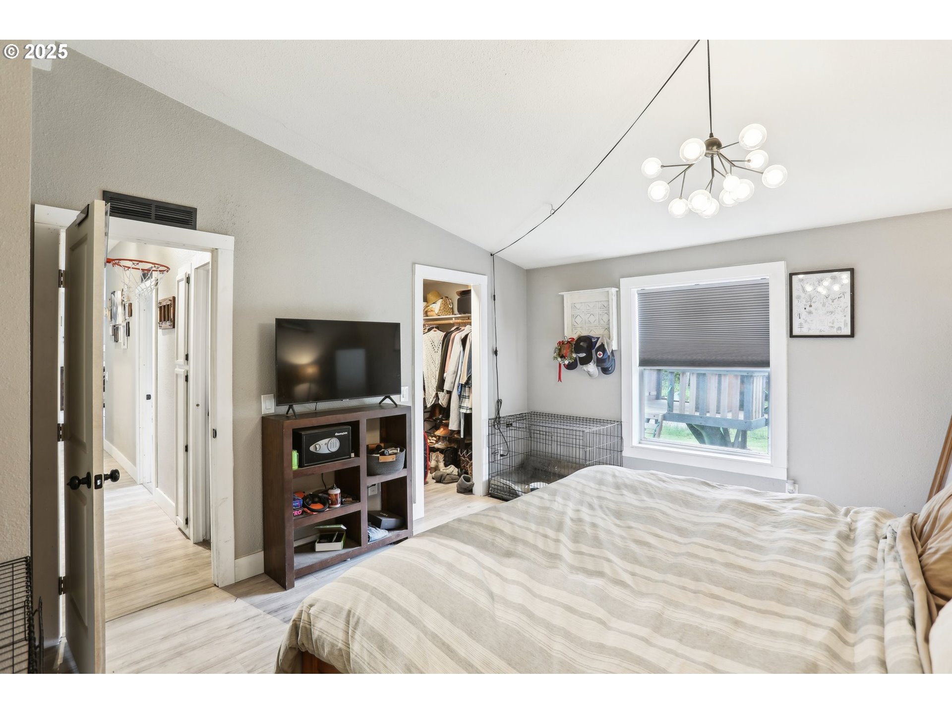 39585 Southwest Lasalle Road Gaston, OR 97119 - Photo 23 of 44 a bedroom with a bed and a flat screen tv
