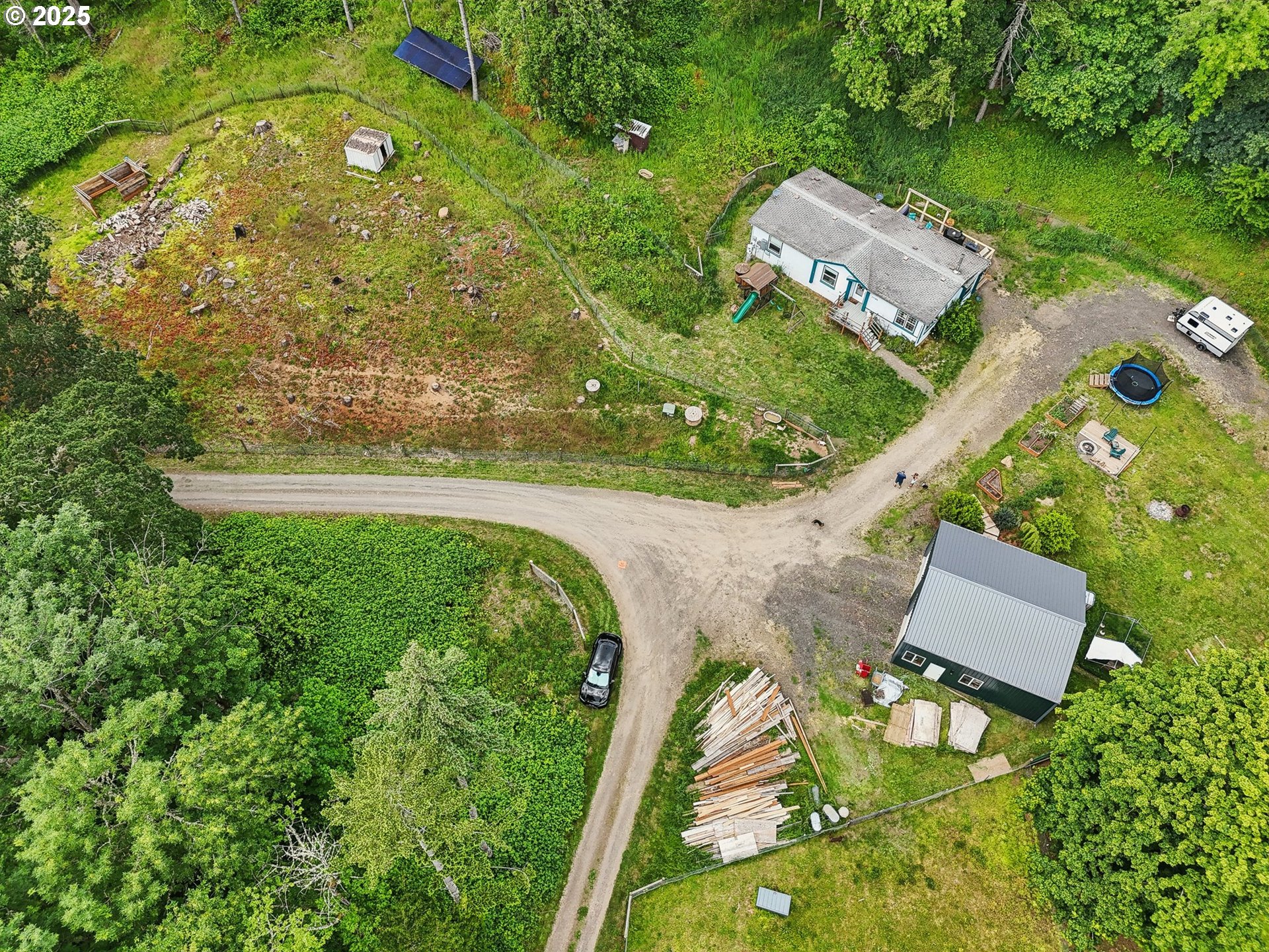 39585 Southwest Lasalle Road Gaston, OR 97119 - Photo 32 of 44 an aerial view of a house with a garden and swimming pool