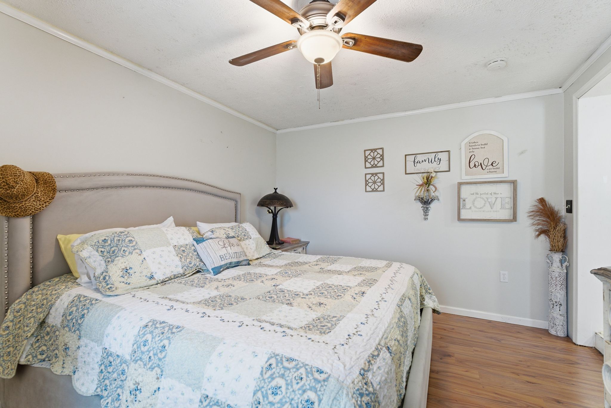 404 Logan Chapel Road Hillsboro, TN 37342 - Photo 16 of 38 a bedroom with a bed and a chandelier