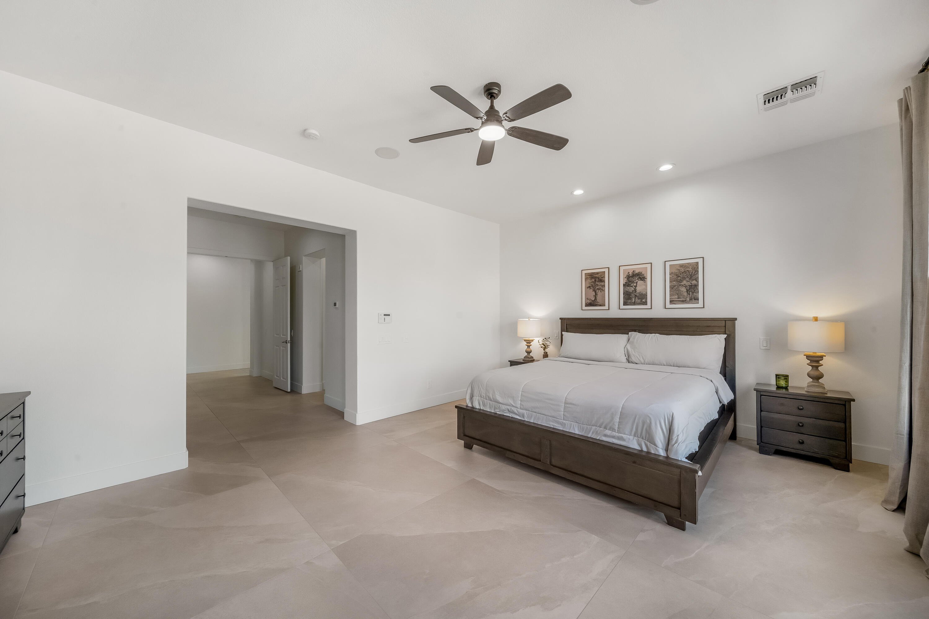 80262 Amazon Avenue Indio, CA 92201 - Photo 46 of 69 a spacious bedroom with a bed and window