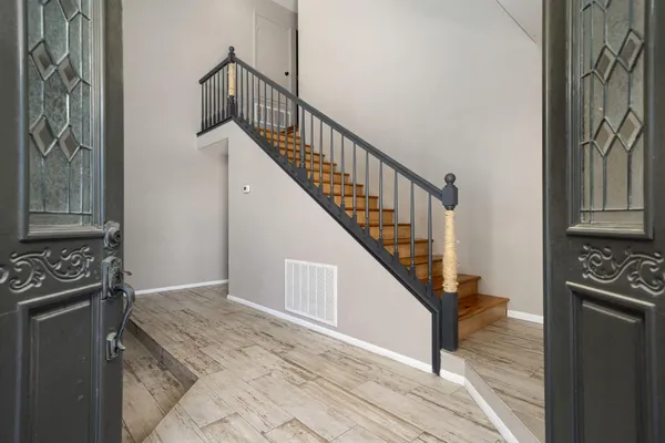 a kitchen with granite countertop white cabinets white stainless steel appliances and sink