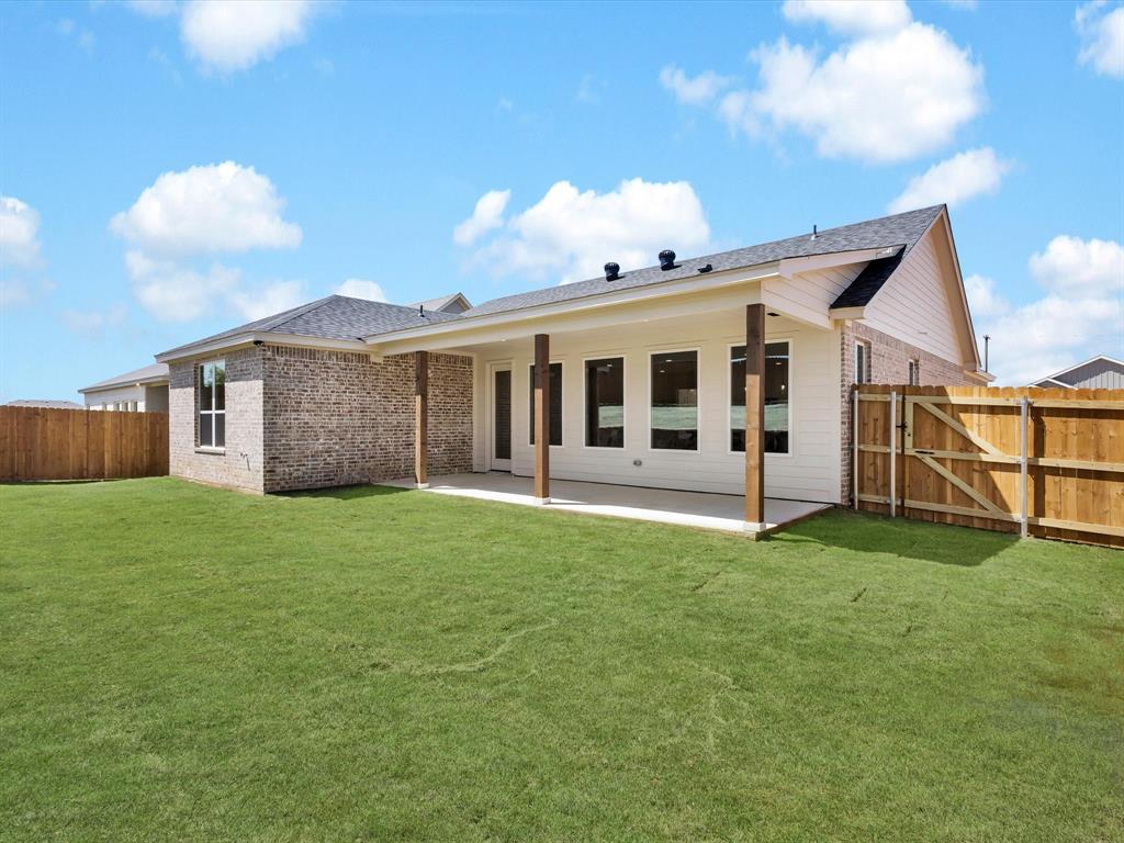 612 Jameson Springtown, TX 76082 - Photo 13 of 13 a view of a house with a backyard