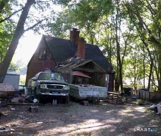 a view of a car park in front of a house