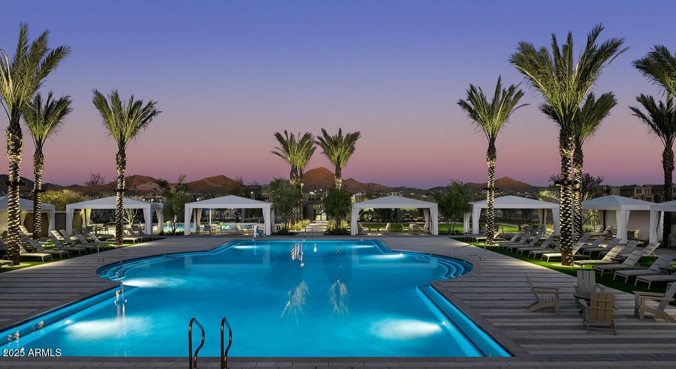 2453 West Maximo Way Phoenix, AZ 85085 - Photo 18 of 19 a swimming pool with outdoor seating and yard