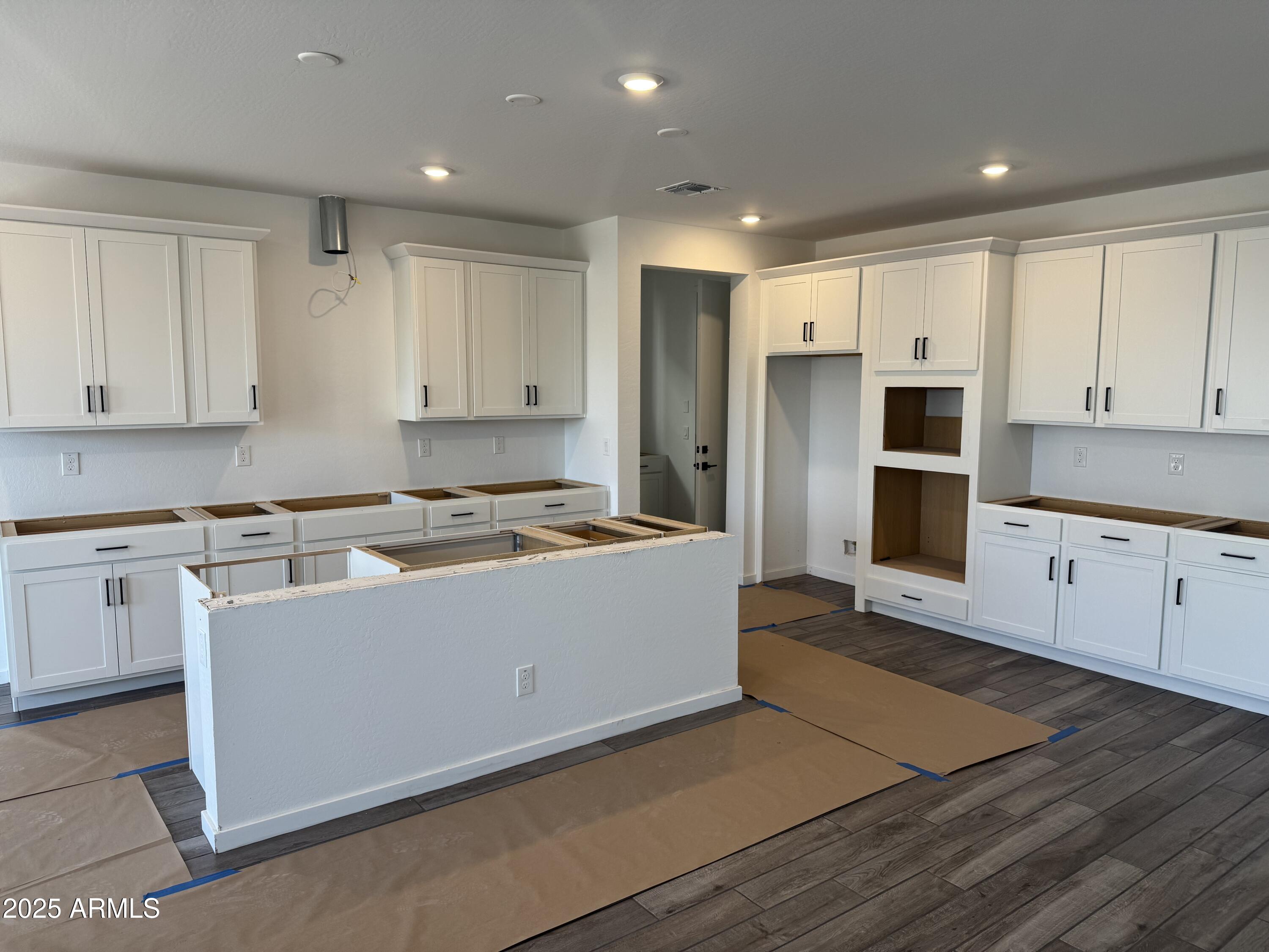 2453 West Maximo Way Phoenix, AZ 85085 - Photo 2 of 19 a kitchen with stainless steel appliances granite countertop a refrigerator and a stove top oven