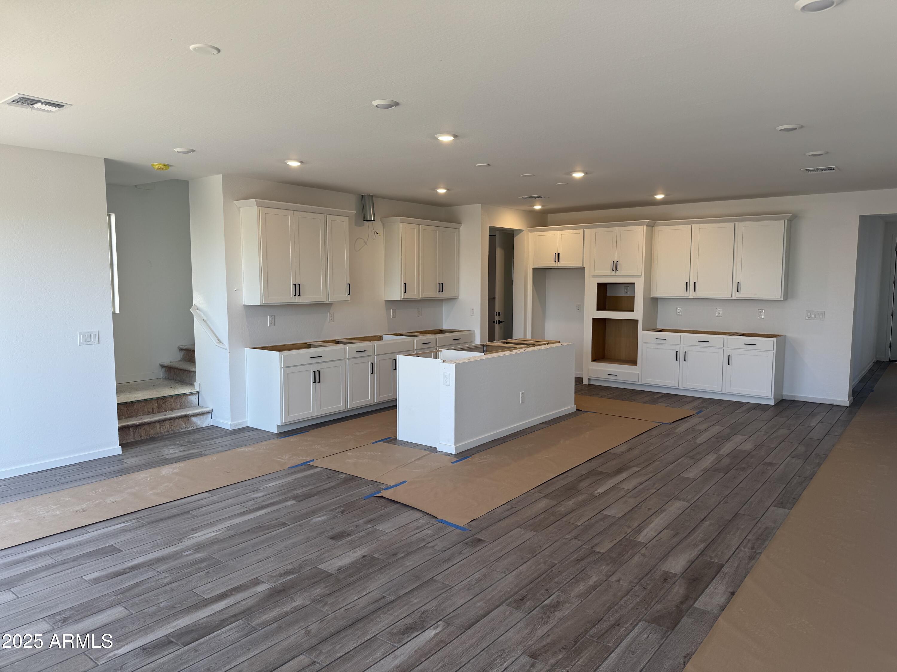 2453 West Maximo Way Phoenix, AZ 85085 - Photo 4 of 19 a view of kitchen with wooden floor