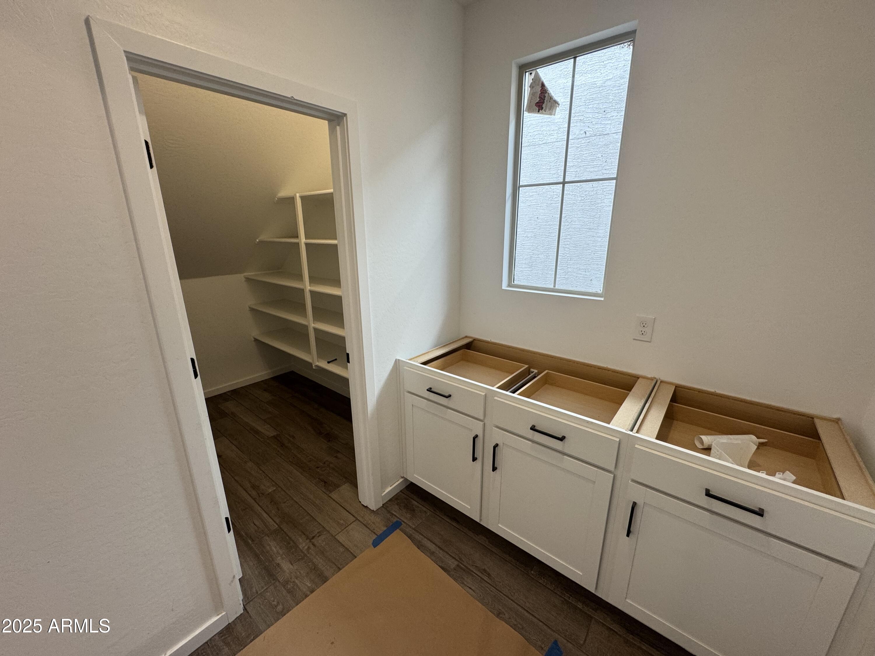 2453 West Maximo Way Phoenix, AZ 85085 - Photo 5 of 19 a view of storage and utility room with washer and dryer