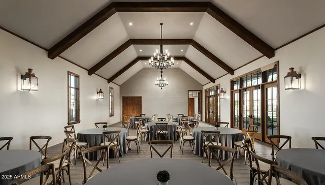 a room with lots of tables and chairs