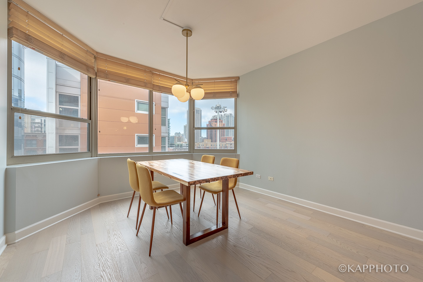 720 West Randolph Street, Unit 908 Chicago, IL 60661 - Photo 8 of 41 a dining room with a table and chairs