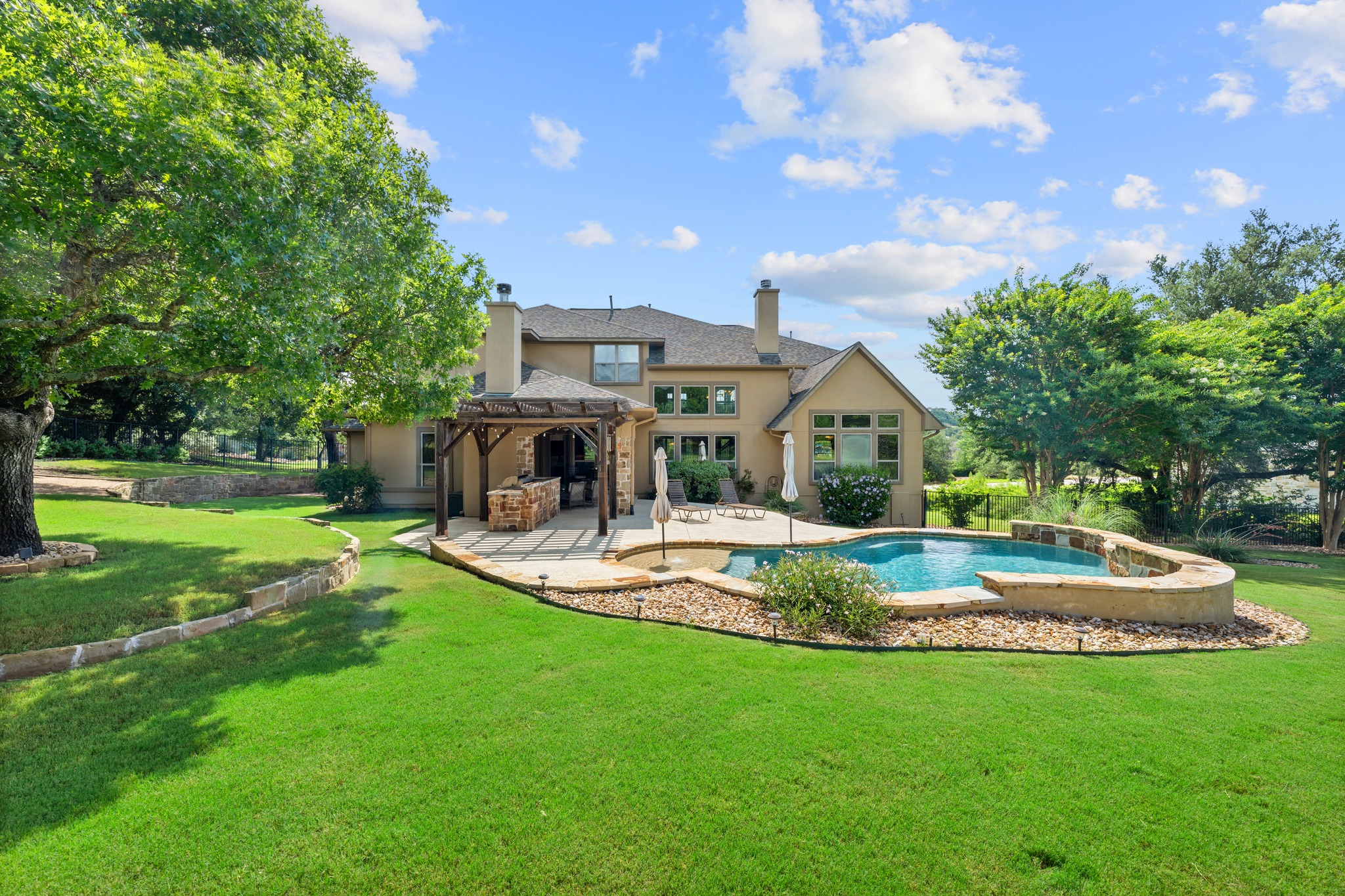 1301 Lions Lair Leander, TX 78641 - Photo 33 of 40 Private pool setting surrounded by lush green lawn