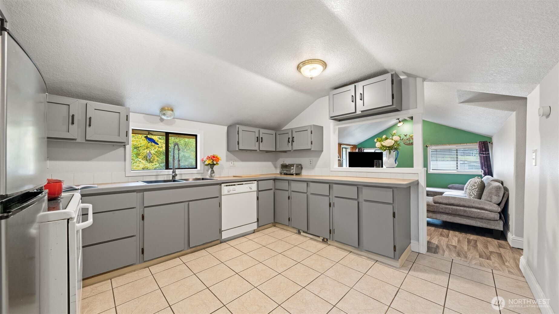 10246 Mill Creek Road Walla Walla, WA 99362 - Photo 6 of 31 a kitchen with sink cabinets and window