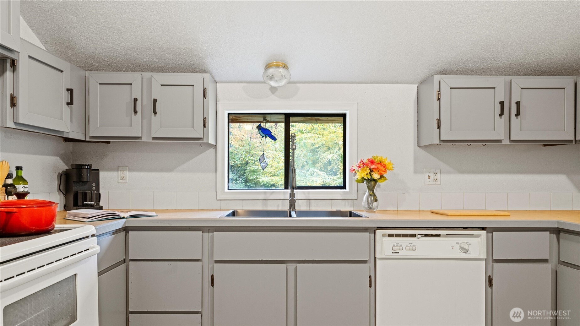 10246 Mill Creek Road Walla Walla, WA 99362 - Photo 8 of 31 a kitchen with appliances cabinets and a window