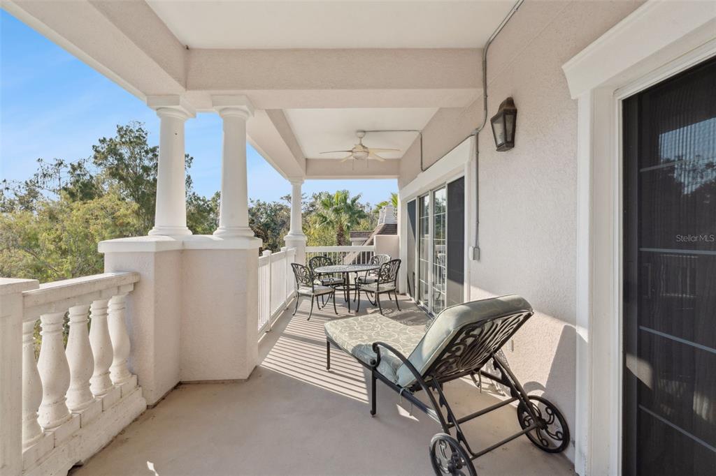 7656 Whisper Way, Unit 402 Reunion, FL 34747 - Photo 28 of 57 a view of a dining room with furniture window and outside view