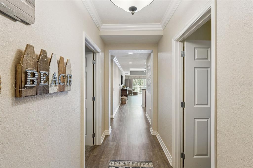 7656 Whisper Way, Unit 402 Reunion, FL 34747 - Photo 3 of 57 a view of a hallway with living room and furniture