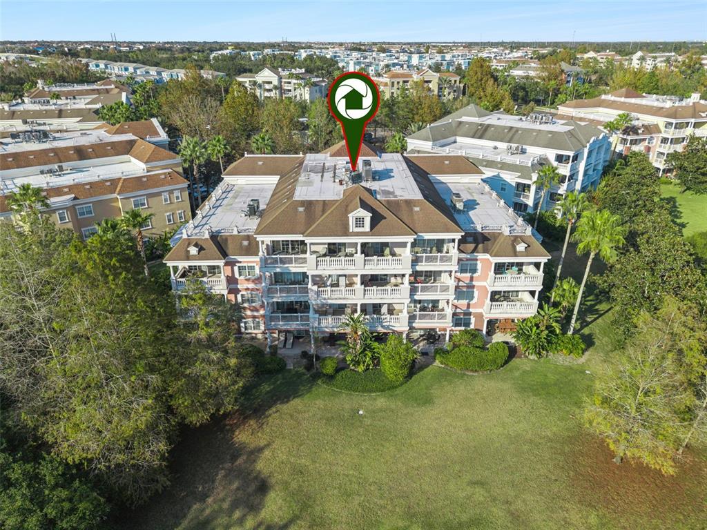 7656 Whisper Way, Unit 402 Reunion, FL 34747 - Photo 37 of 57 an aerial view of residential houses with outdoor space and street view