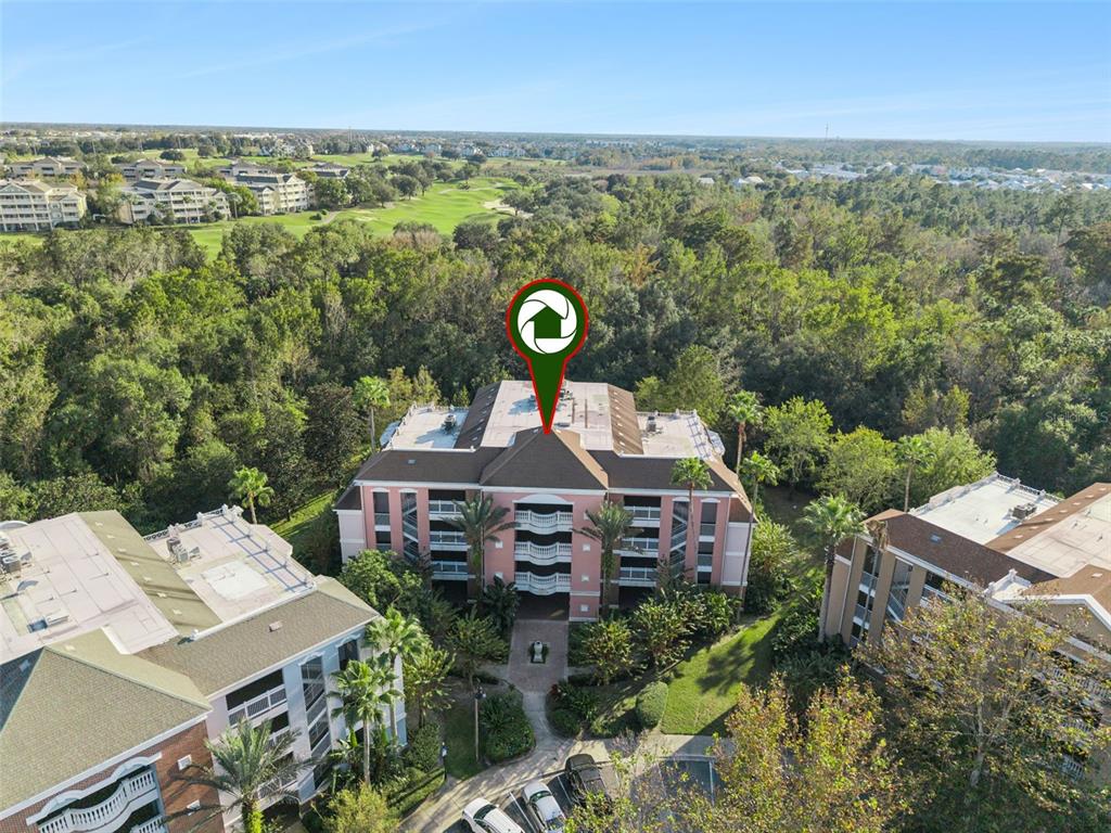 7656 Whisper Way, Unit 402 Reunion, FL 34747 - Photo 39 of 57 an aerial view of a house with a garden