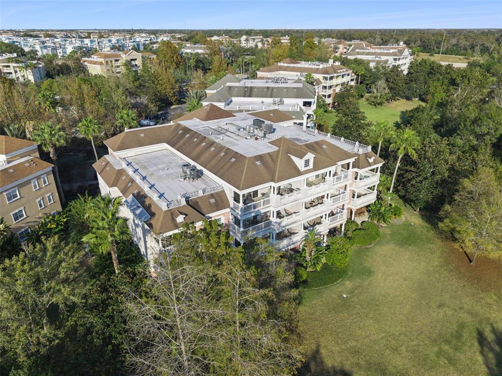 7656 Whisper Way, Unit 402 Reunion, FL 34747 - Photo 40 of 57 an aerial view of a house with a yard