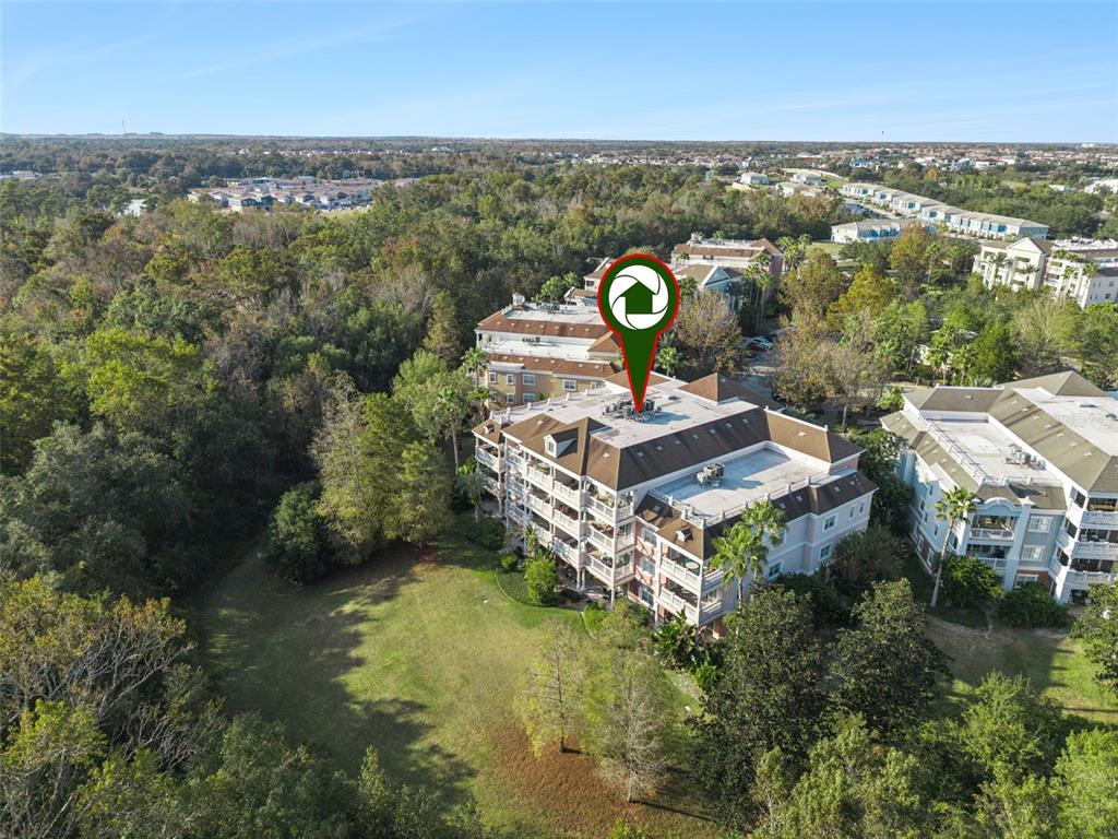 7656 Whisper Way, Unit 402 Reunion, FL 34747 - Photo 42 of 57 an aerial view of a house with a garden