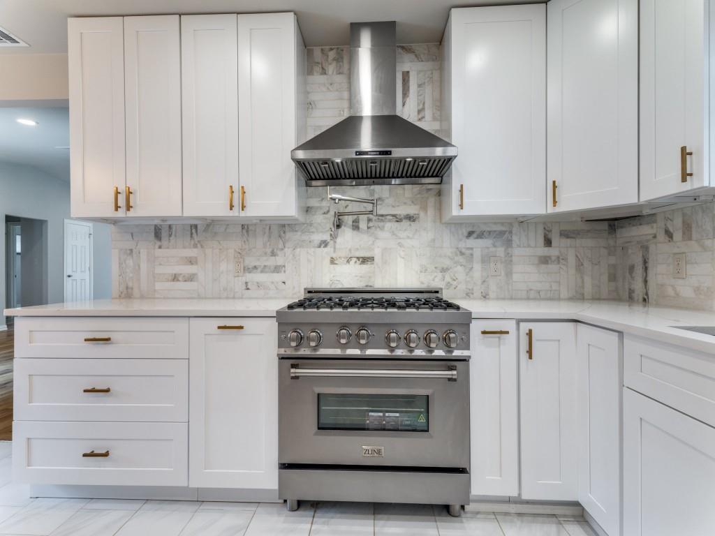 2001 Pebblebrook Trail Irving, TX 75060 - Photo 14 of 28 a stove top oven sitting inside of a kitchen