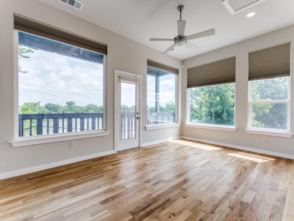 2001 Pebblebrook Trail Irving, TX 75060 - Photo 18 of 28 a view of an empty room with wooden floor and a window