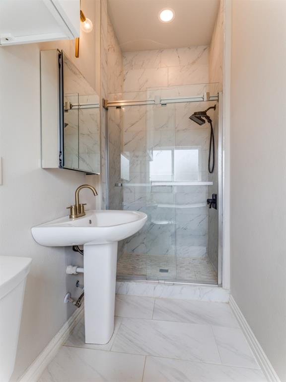 2001 Pebblebrook Trail Irving, TX 75060 - Photo 21 of 28 a bathroom with a sink shower and mirror