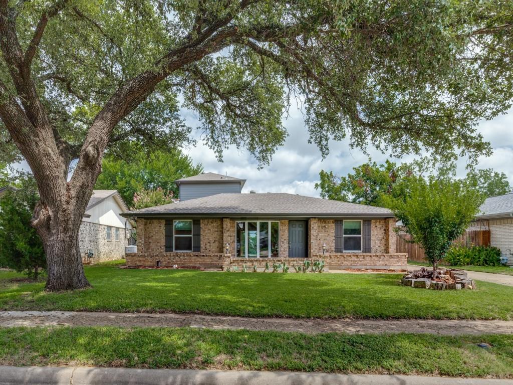 2001 Pebblebrook Trail Irving, TX 75060 - Photo 28 of 28 a front view of a house with a garden