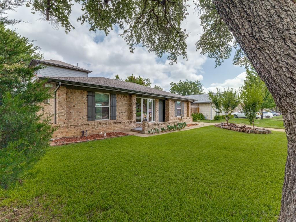 2001 Pebblebrook Trail Irving, TX 75060 - Photo 3 of 28 a backyard of a house with table and chairs