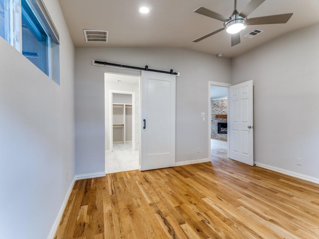 2001 Pebblebrook Trail Irving, TX 75060 - Photo 10 of 28 a view of empty room with wooden floor and fan