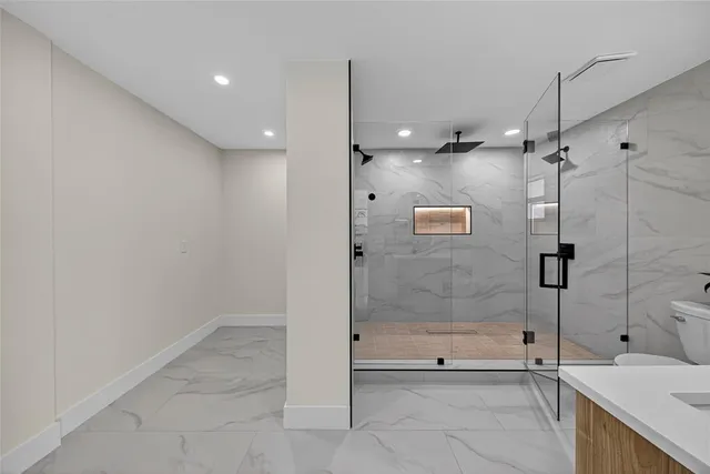 a kitchen with a refrigerator and a sink