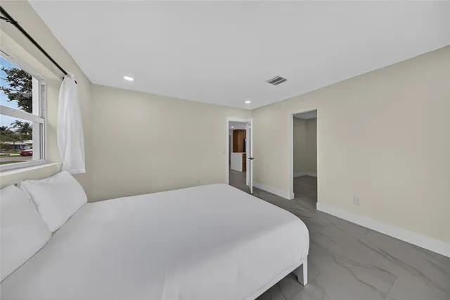 a view of an empty room with a fireplace