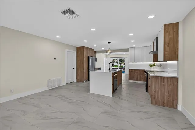 a living room with fireplace furniture and a wooden floor