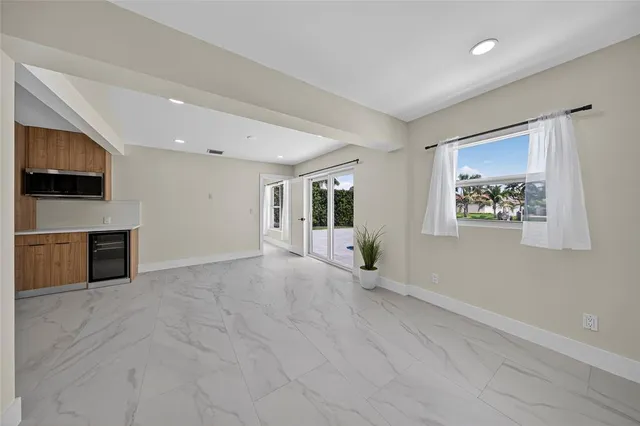a bathroom with a toilet sink vanity tub and shower