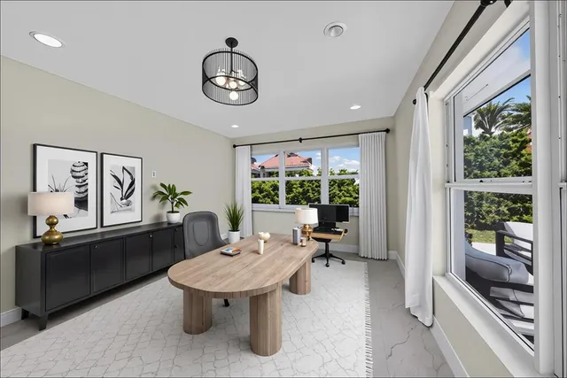 a view of an empty room with closet and a window