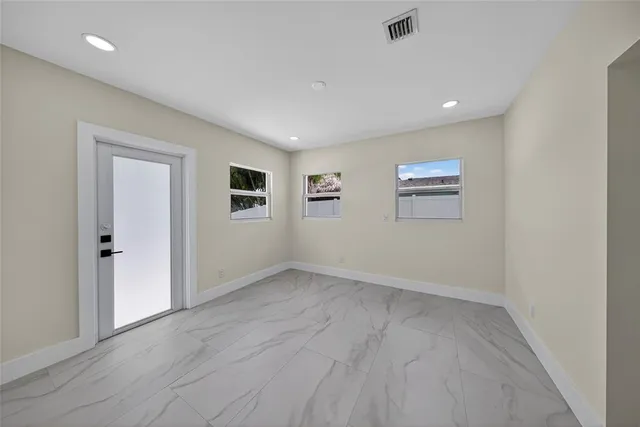 a utility room with cabinets